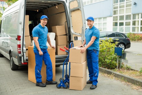 Office clearance process in action with workers sorting items